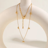 collier pendentif nœud plaquée or